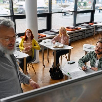high-angle-adults-studying-together_23-2150331646